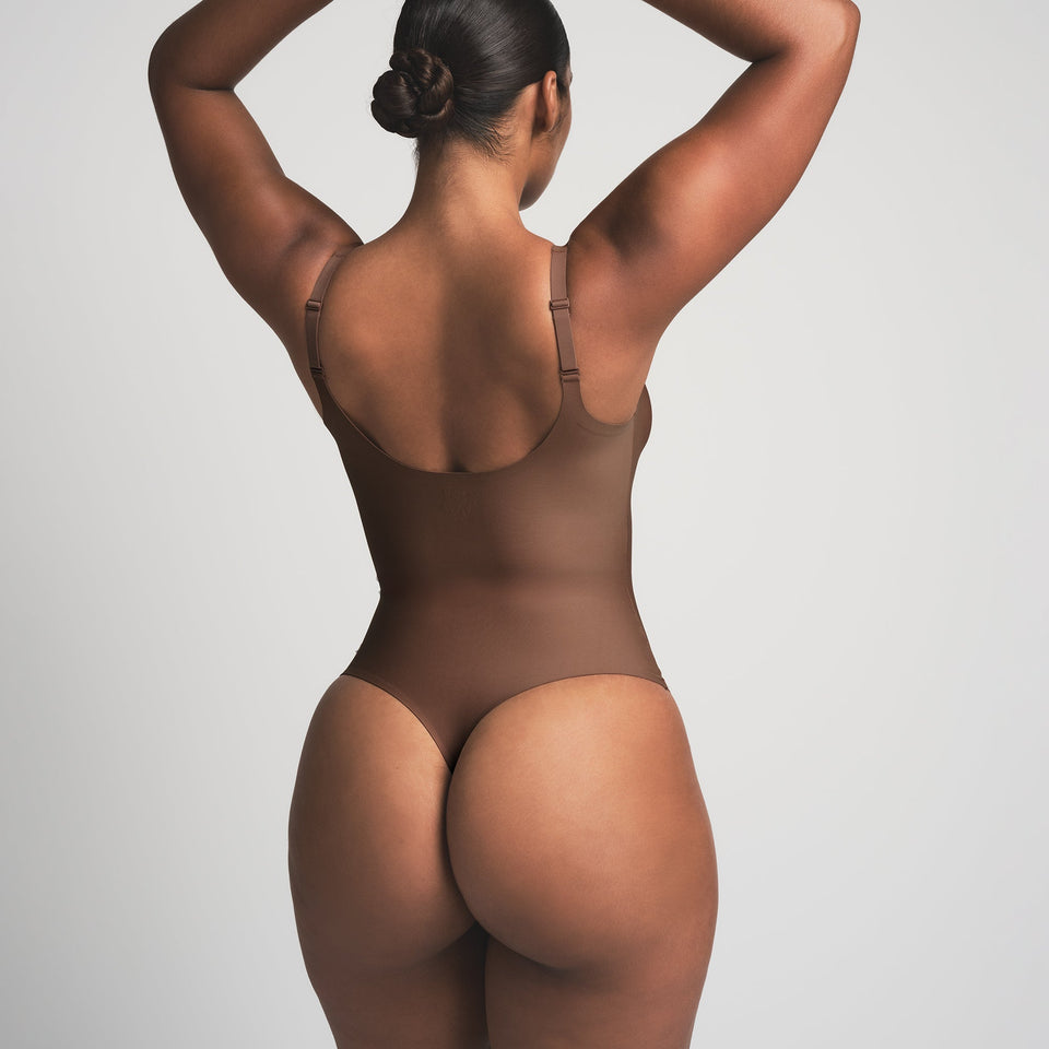 SKIMS BODY UNLINED PLUNGE THONG BODYSUIT | JASPER