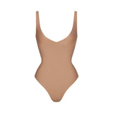 SKIMS BODY UNLINED PLUNGE THONG BODYSUIT | SIENNA