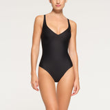 SKIMS BODY UNLINED PLUNGE THONG BODYSUIT | ONYX